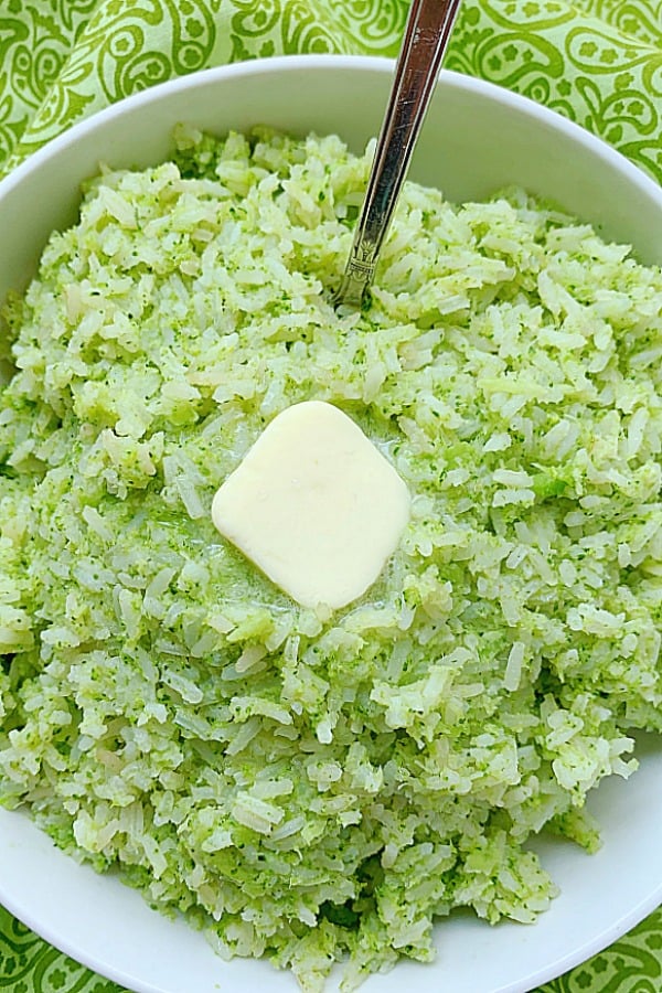 broccoli rice in a bowl topped with butter