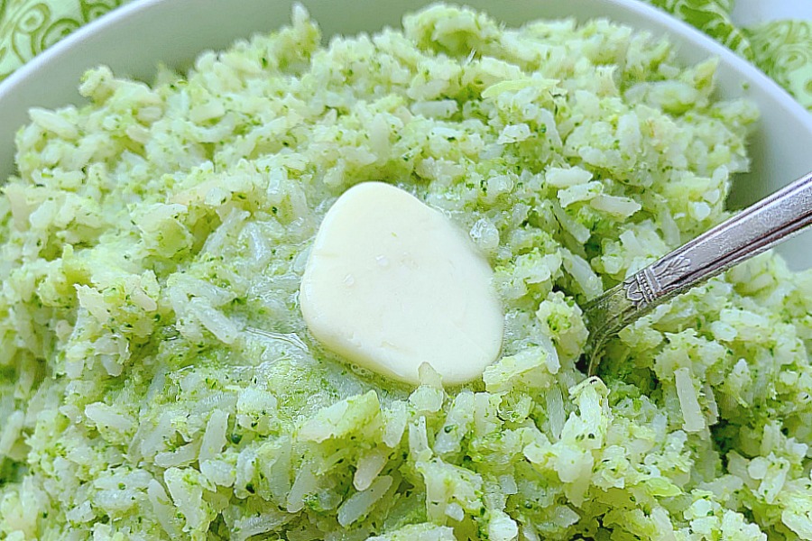 broccoli rice in a bowl topped with butter