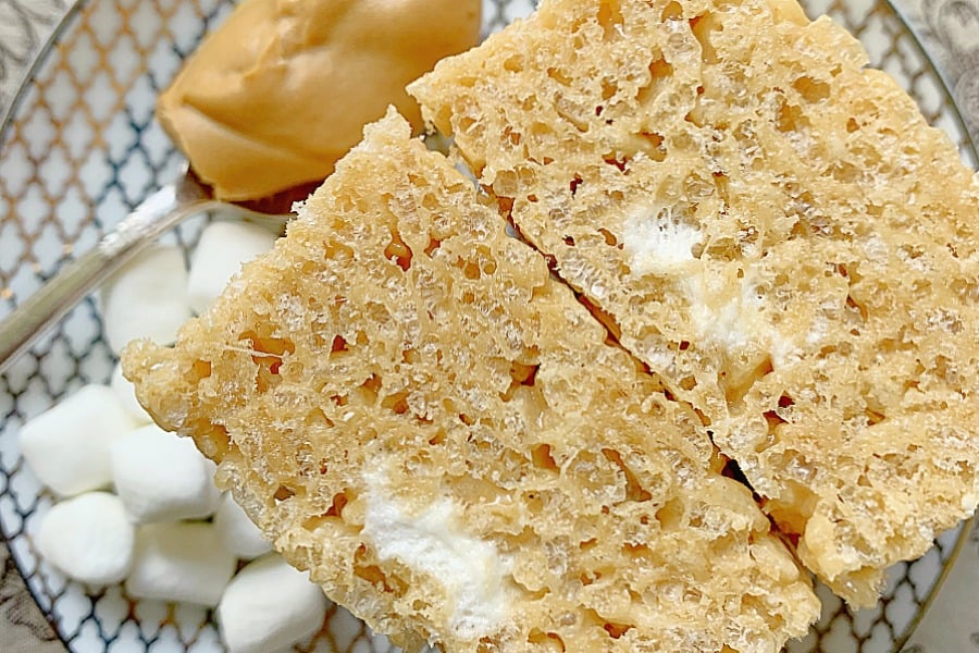 side view of two peanut butter rice krispie treats on a plate