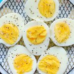 air fryer eggs cut in half and sprinkled with salt and pepper