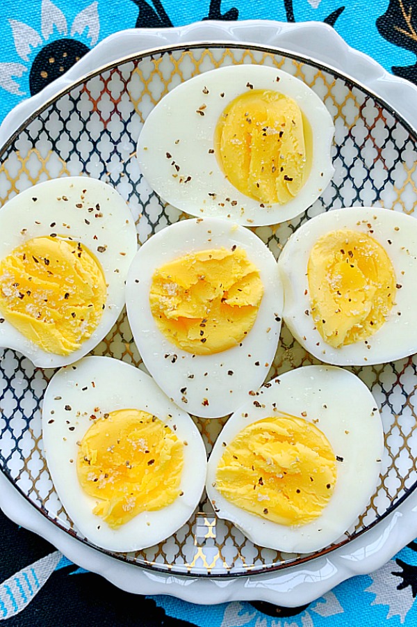 air fryer eggs cut in half and sprinkled with salt and pepper