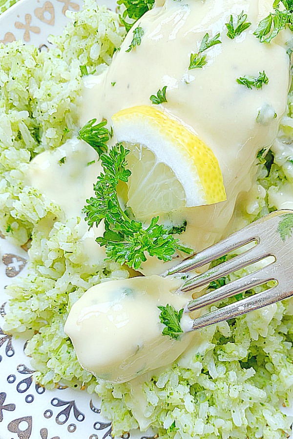 taking a bite of creamy lemon chicken