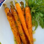 vertical crop of air fryer carrots on a plate