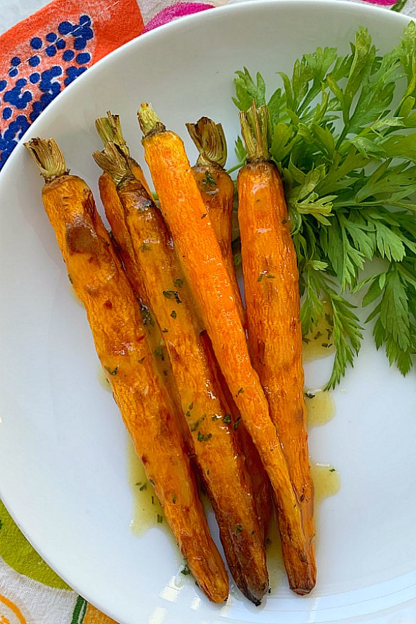 vertical crop of air fryer carrots on a plate