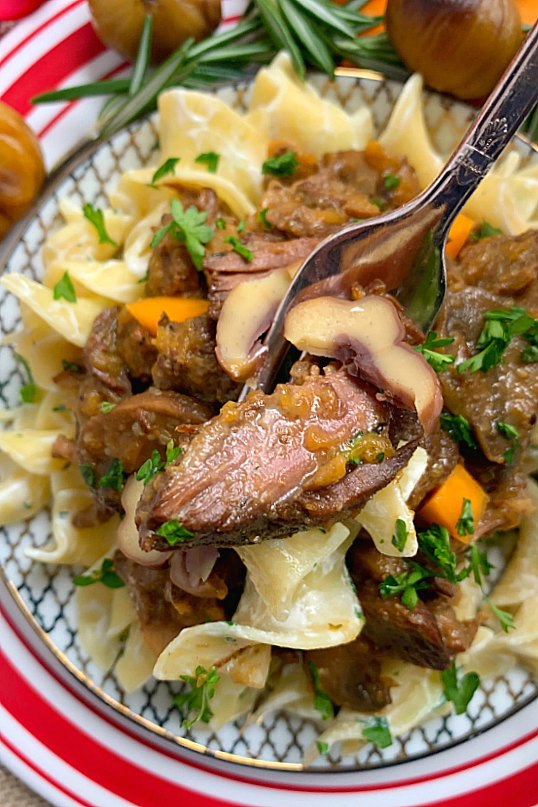 taking a bite of chestnut beef stew