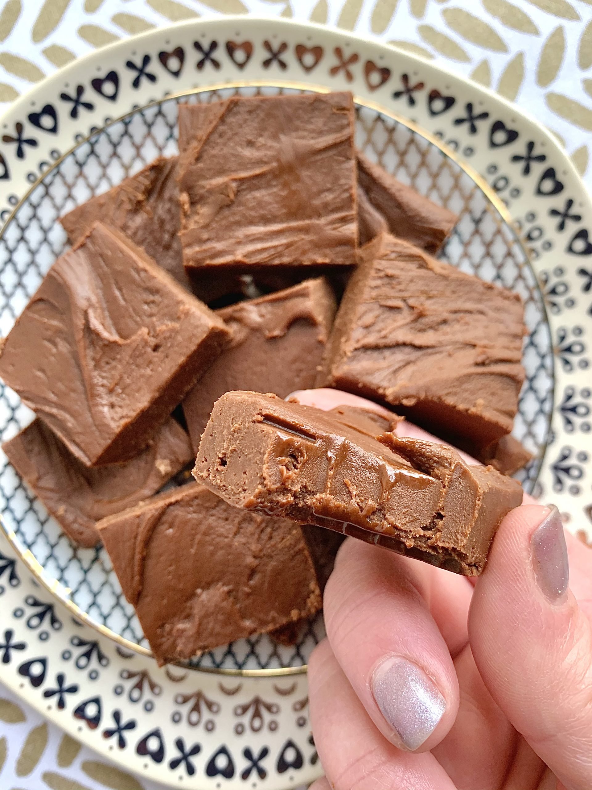 taking a bite of chocolate microwave fudge