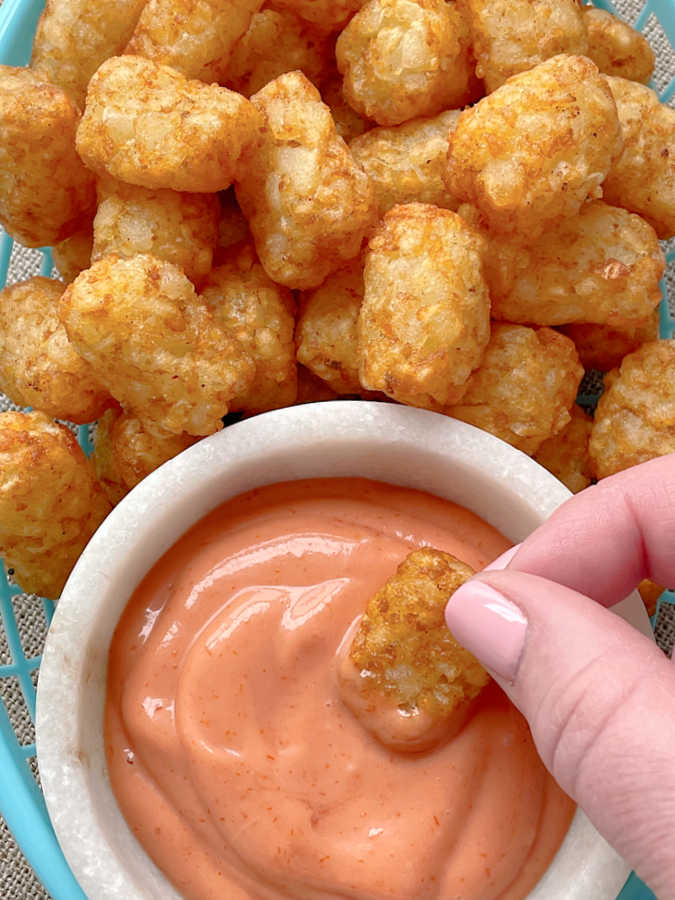 dipping air fryer tater tots in fry sauce
