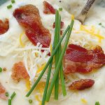 horizontal crop of a bowl of easy loaded baked potato soup