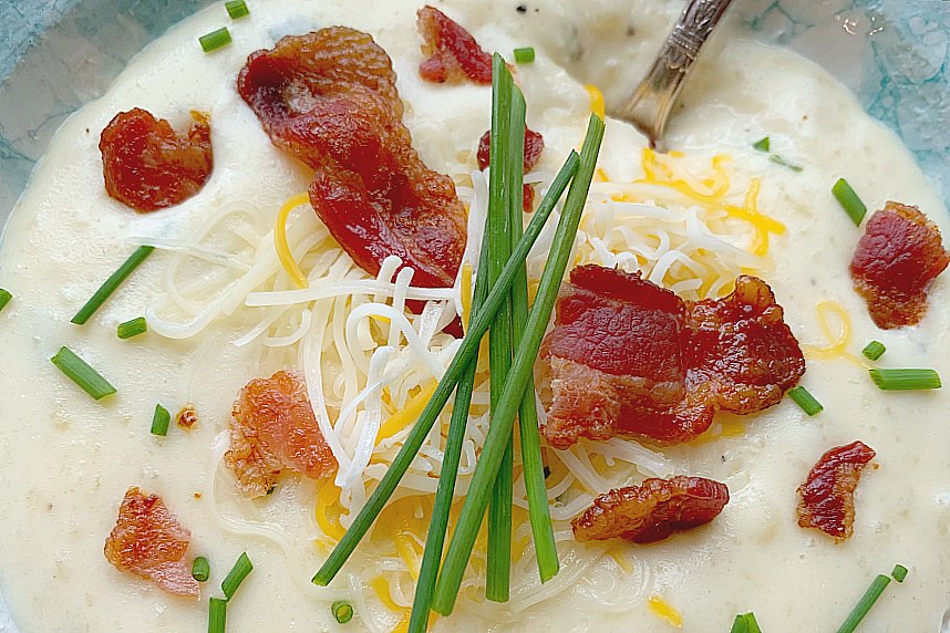 horizontal crop of a bowl of easy loaded baked potato soup