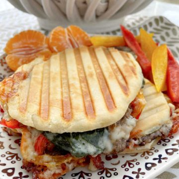 Panini Sandwich filled with steak, cheese, peppers and onions