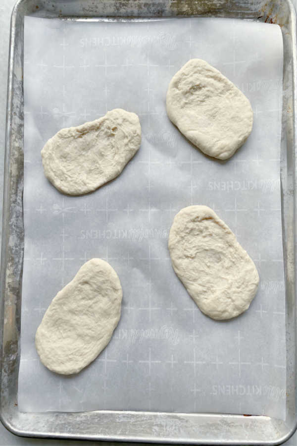 panini bread dough on sheet pans rising