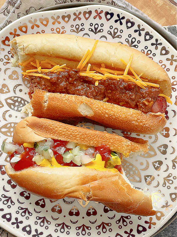 taking a bite out of an air fryer coney dog