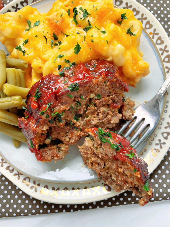 taking a bite of air fryer meatloaf