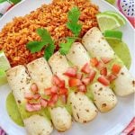 air fryer taquitos on a plate with rice