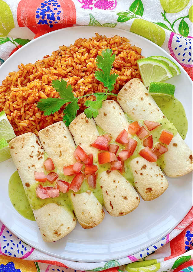 air fryer taquitos on a plate with rice