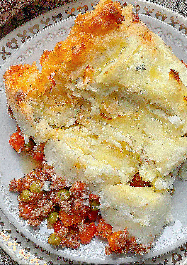 smashed piece of shepherd's pie to show potato crust and lamb filling