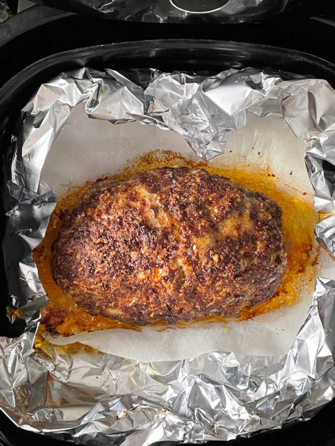 cooked meatloaf in the air fryer basket