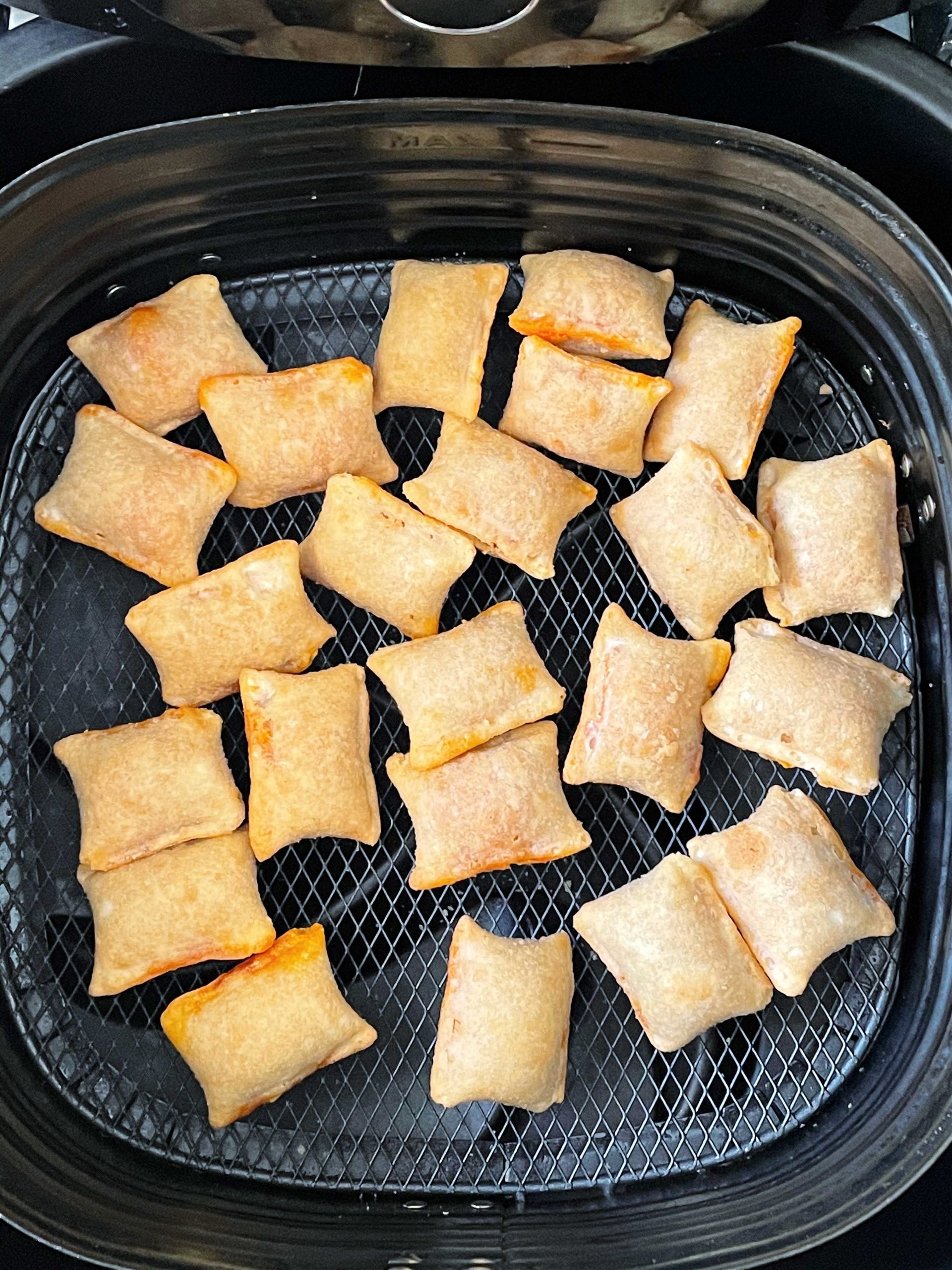 cooked pizza rolls in the air fryer basket