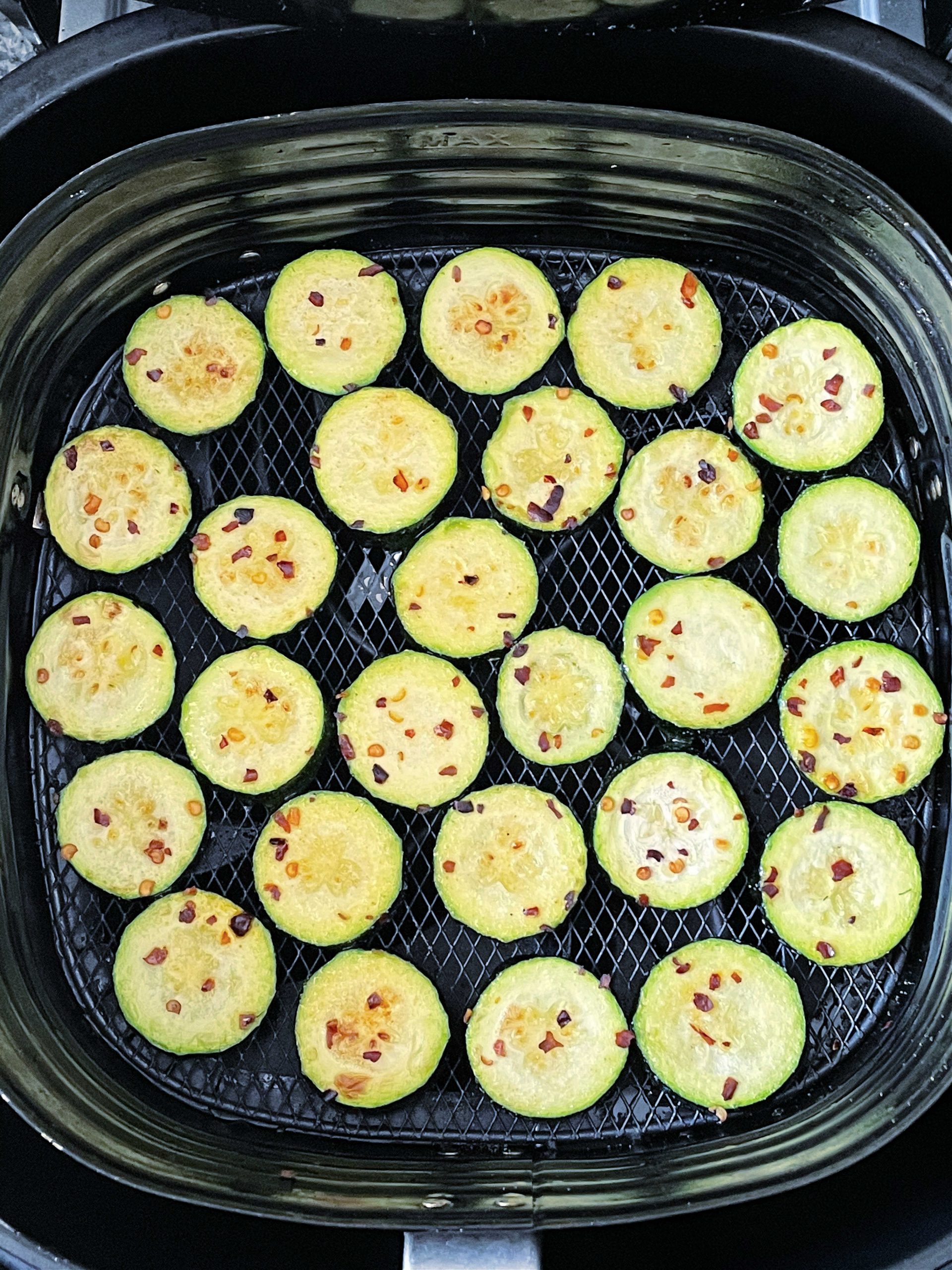 zucchini slices in the air fryer basket