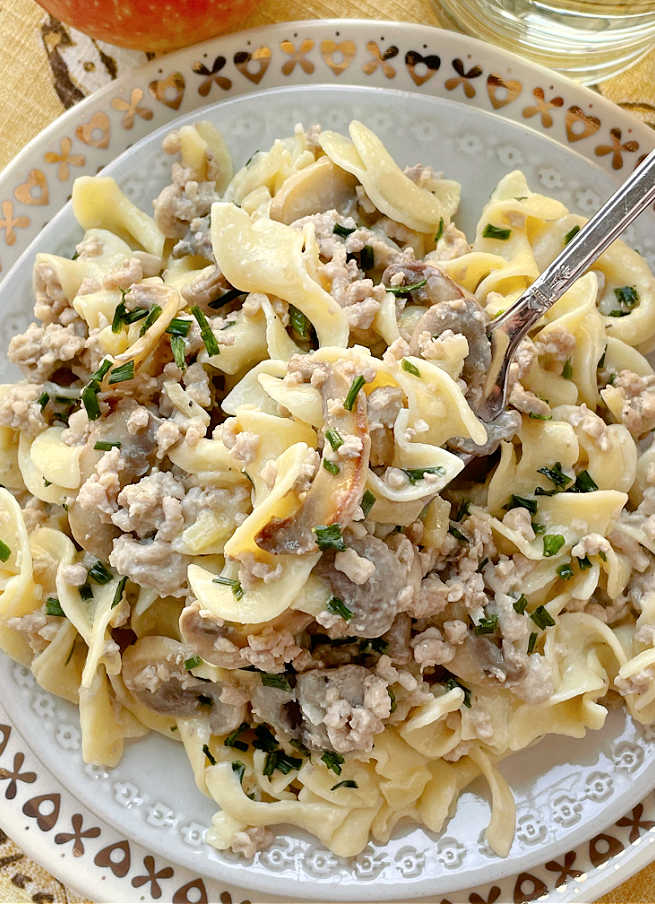 taking a bite of pork stroganoff