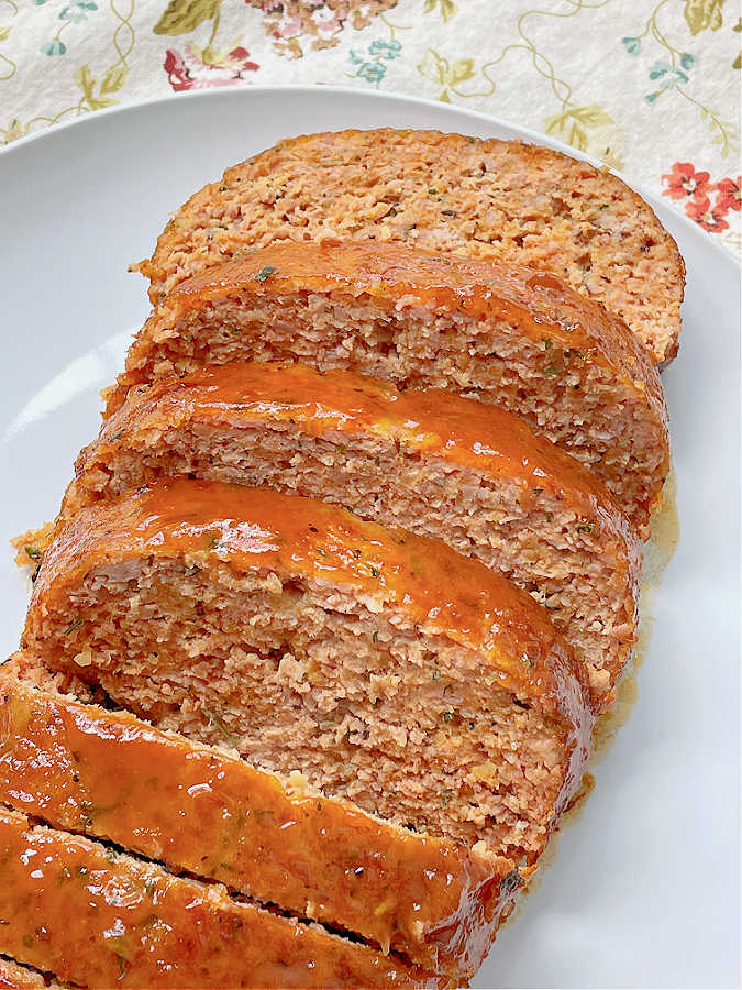 ham loaf sliced on a plate