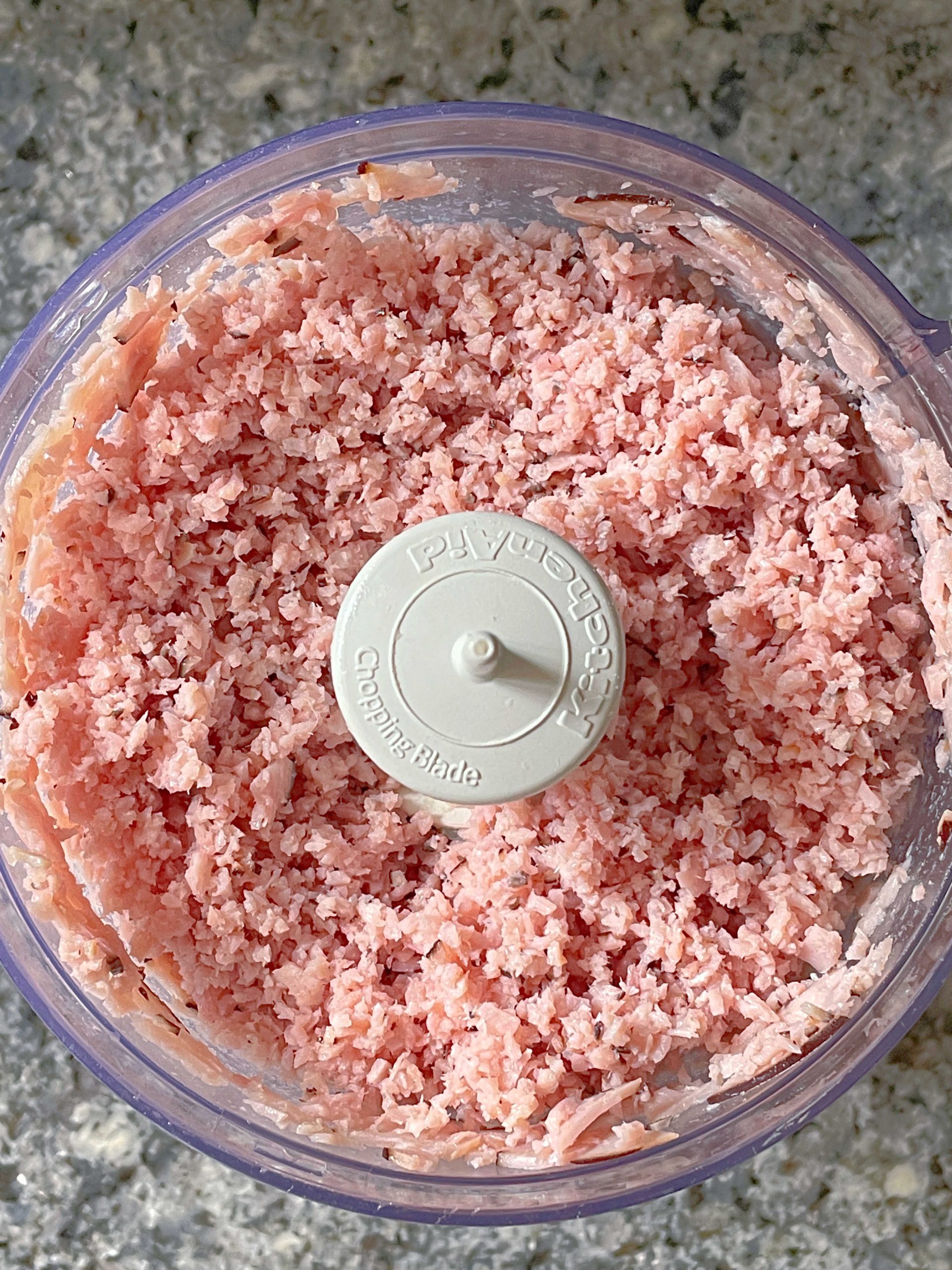 finely chopped ham in the bowl of a food processor