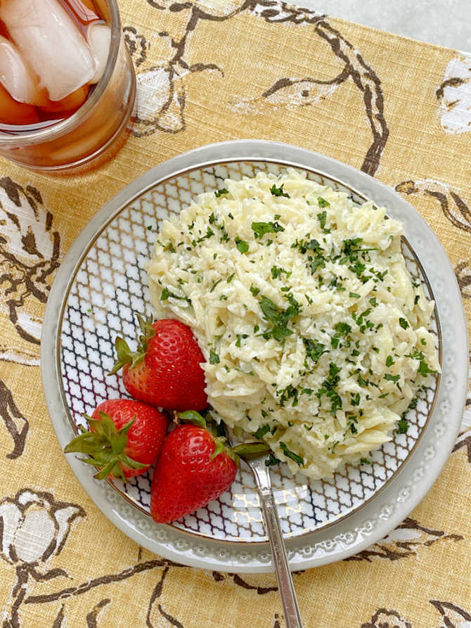 alfredo risoni plated up with fresh strawberries