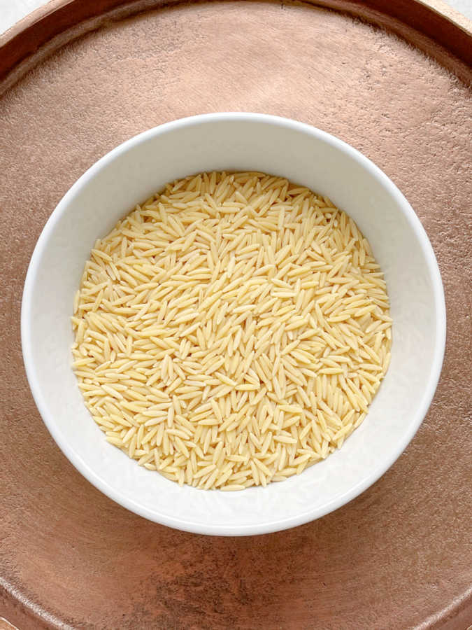 a dish of uncooked risoni pasta