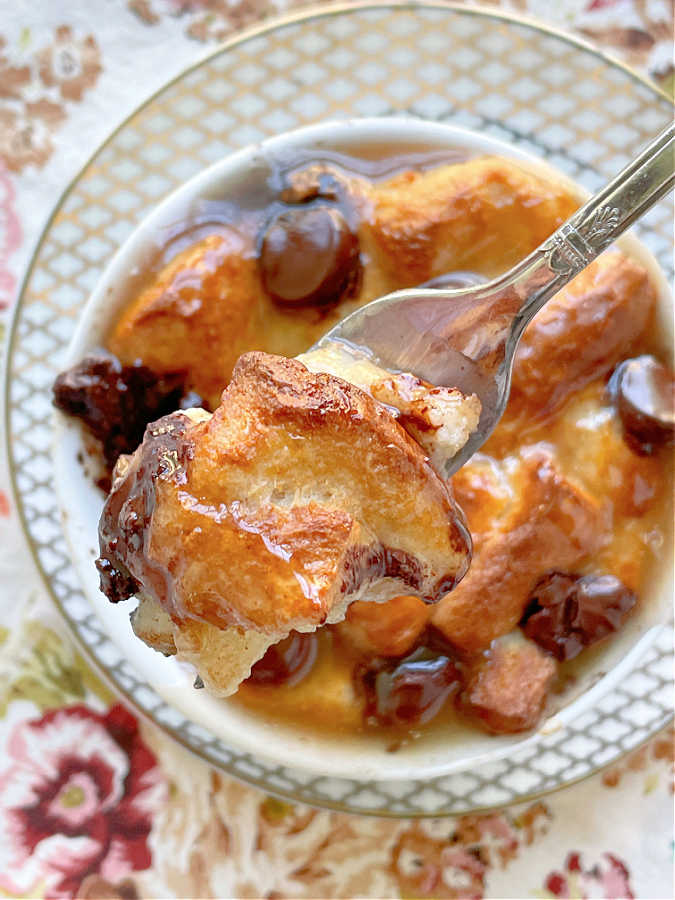 taking a bite of air fryer bread pudding