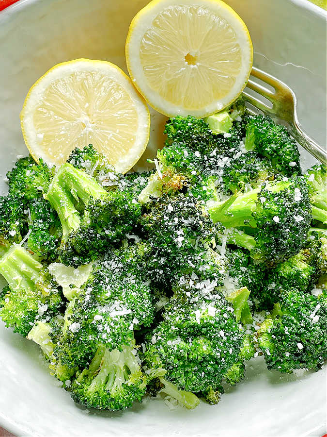 air fryer broccoli topped with Parmesan cheese