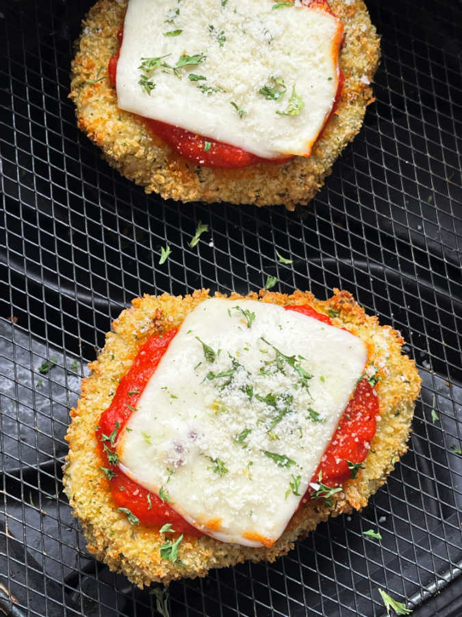 cooked chicken parmesan in the air fryer basket