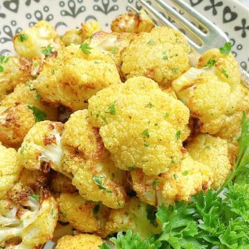 Air Fryer Cauliflower is such a great side dish to make. Fresh cauliflower, a little curry powder and salt cook to perfect crisp tenderness.
