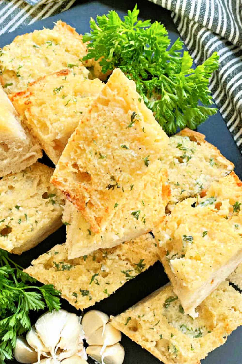 My easy recipe perfectly toasts fresh garlic cloves in the air fryer to make the most delicious and buttery homemade loaf of garlic bread. via @foodtasticmom