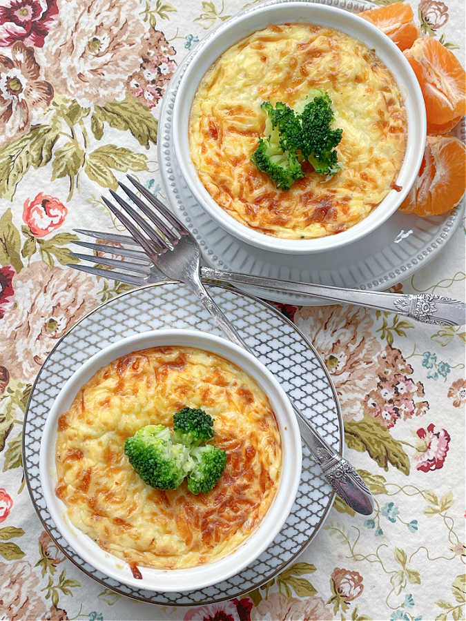 overhead shot of two air fryer quiche topped with broccoli