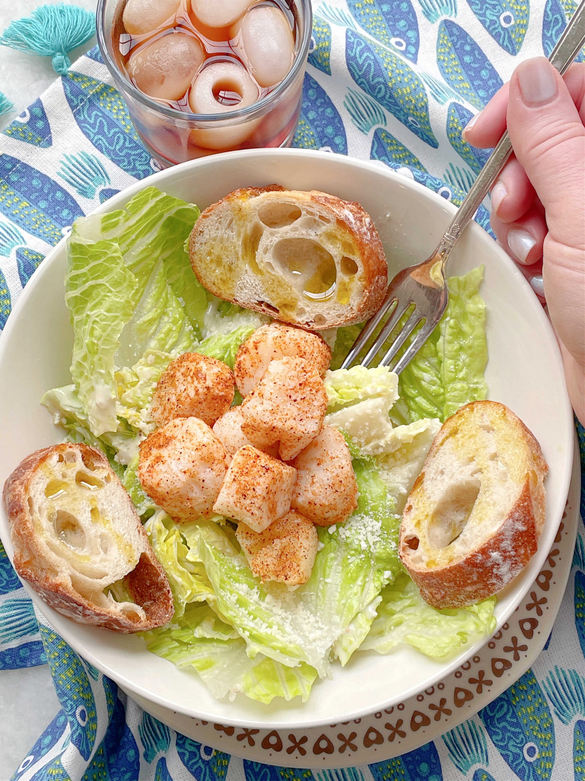 air fryer scallops served on a Caesar salad