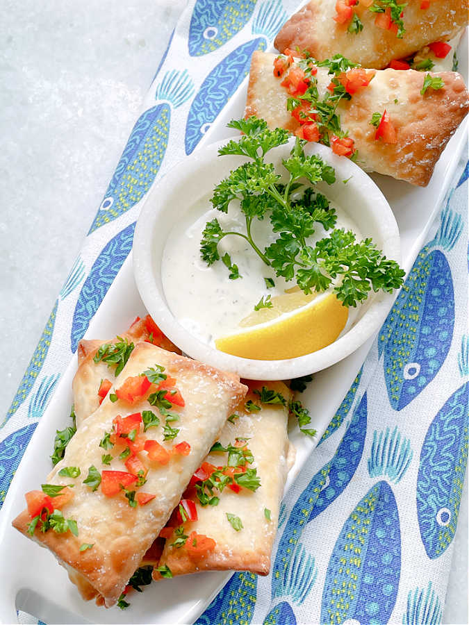 a platter full of air fryer feta cheese rolls