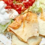 a cheesy slice of air fried quesadilla with a bite taken out of it