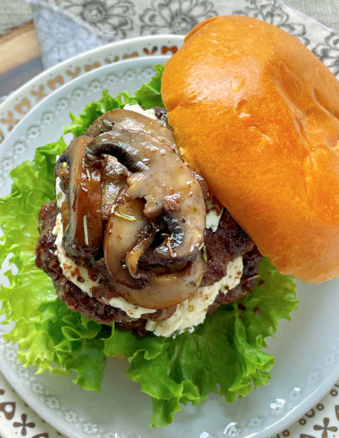 wagyu beef burger topped with sauteéd mushrooms