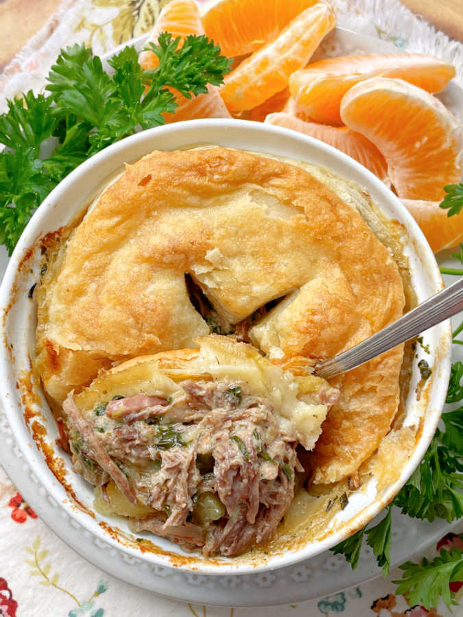 taking a bite of slow cooker steak pie