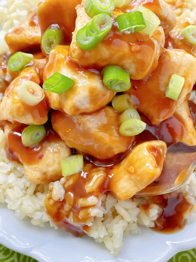 a close up of air fryer orange chicken