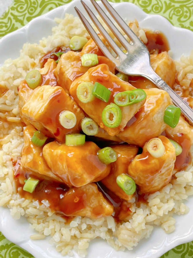 air fryer orange chicken on a plate with rice