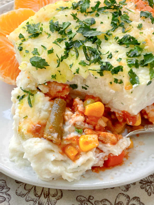 taking a bite of healthy shepherd's pie