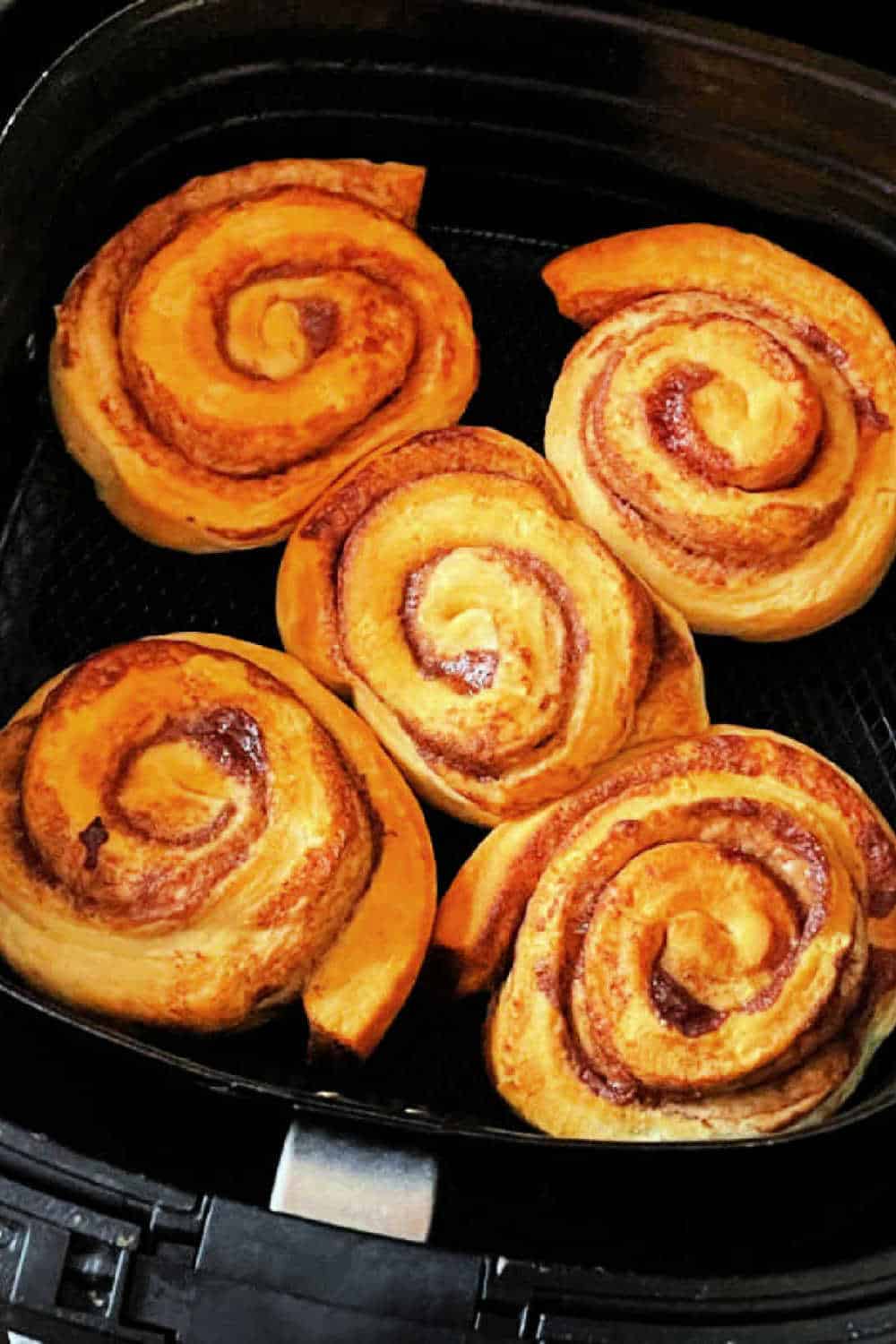 Bake Pillsbury Grands! cinnamon rolls in the air fryer to make a delicious treat for breakfast or anytime of day. via @foodtasticmom