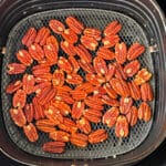 roast pecans in the basket of a phillips xxl air fryer