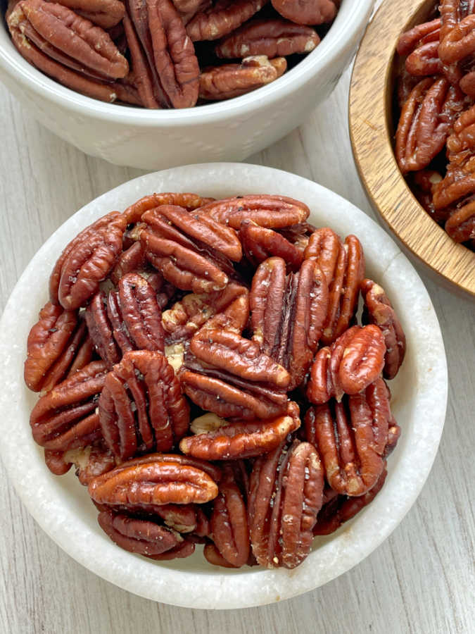 salt and pepper air fryer pecans in a bowl