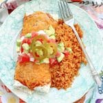 air fryer burrito plated with a side of rice