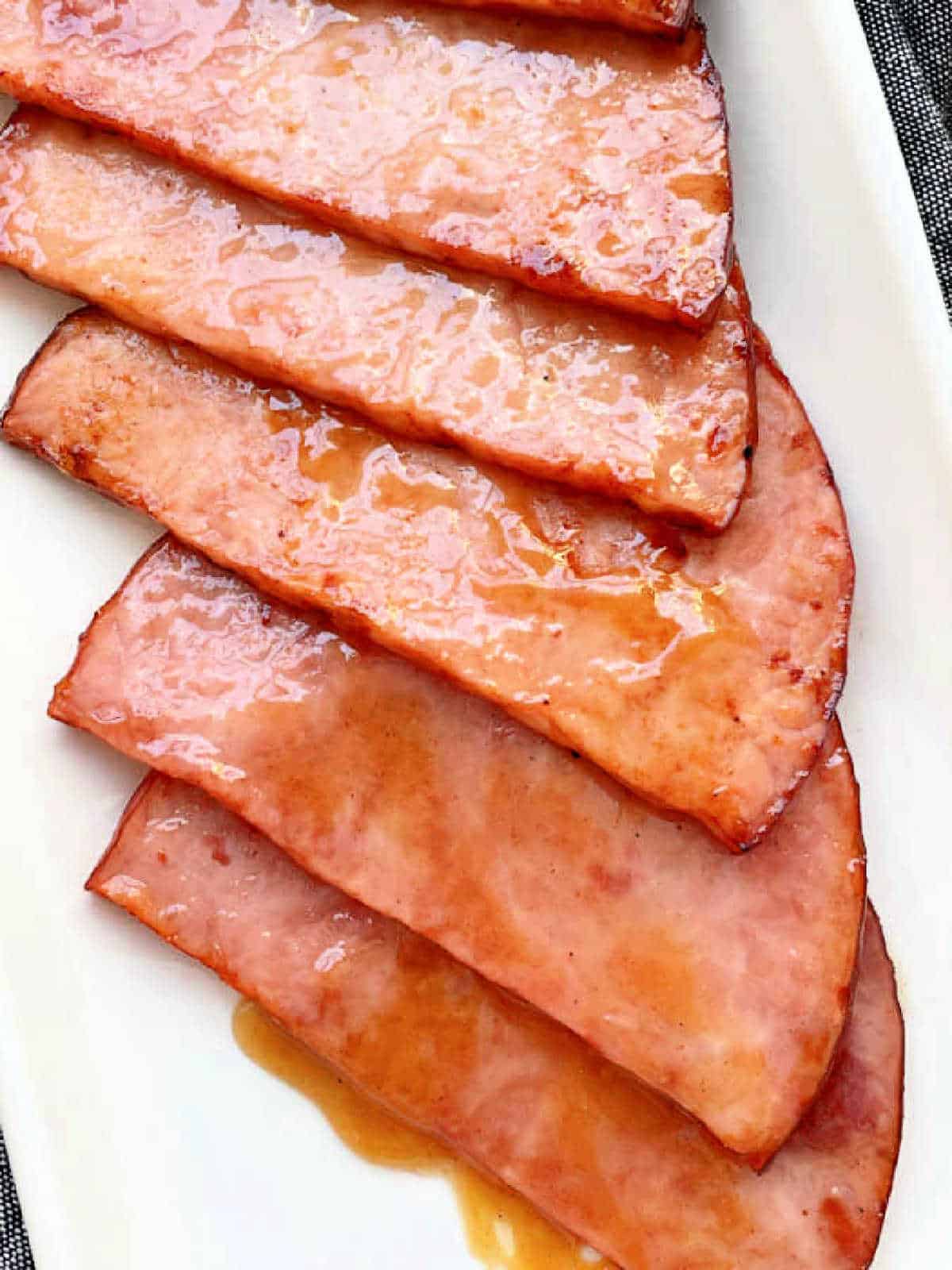 glazed air fryer ham steaks plated on a white platter