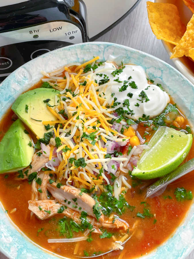 a bowl full of crockpot chicken taco soup