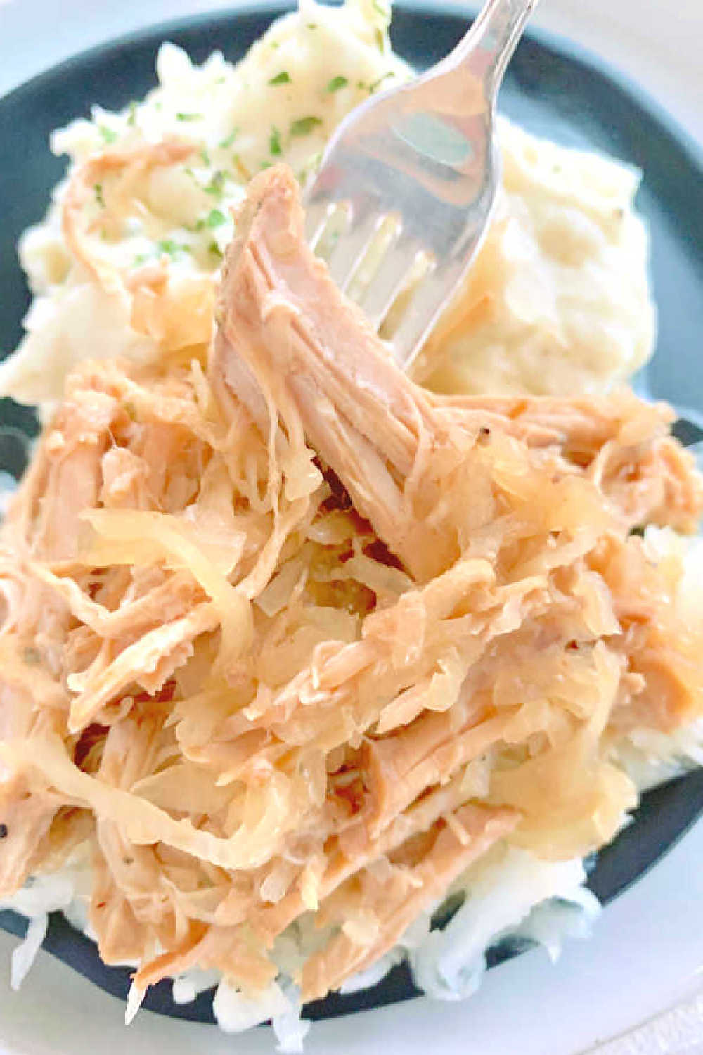 Fix this Slow Cooker Pork and Sauerkraut on New Year's Day to ensure good luck in the coming year. As a pig roots forward, so will you! via @foodtasticmom