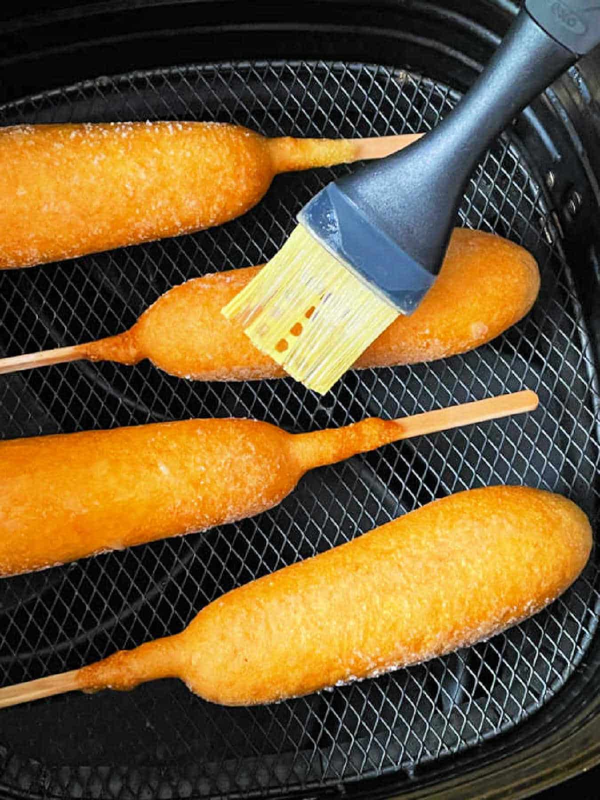 brushing frozen corn dogs with oil before air frying